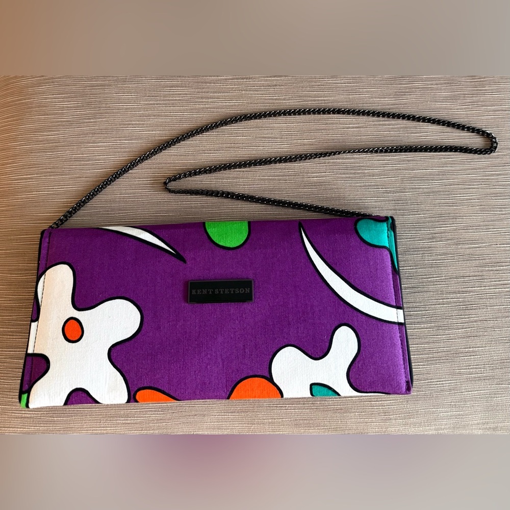 Carry this clutch,handmade by Kent Stetson, and spark fun conversation.Colorful